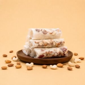 Experience handcrafted Atreyapuram Putharekulu layered with rich cashews, almonds, delicate rice starch sheets, and balanced classic sweetness for an authentic luxury sweet gifting experience.